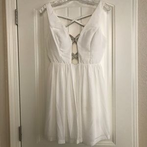 Low cut white dress with bling straps